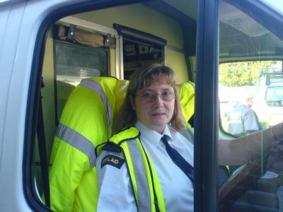 Christine behind the drivers wheel.